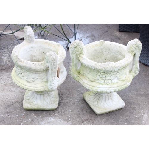 314 - A pair of heavy cast concrete garden pots on stands, each approx 55cm tall