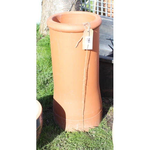 351 - A terracotta chimney pot planter, approx 60cm tall