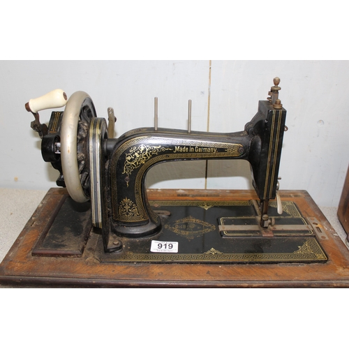 919 - Antique German made sewing machine retailed by Harrods of London