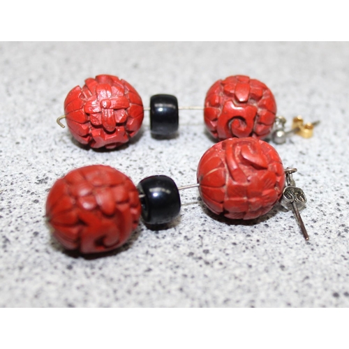 1199M - A Chinese carved bead necklace with silver clasp believed to be cinnabar lacquer, a pair of matching... 