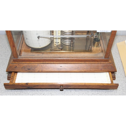 1334 - An antique oak cased barograph with chart drawer and spare charts, thermometer and ink bottle, seemi... 