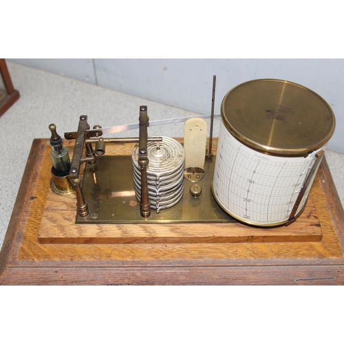 1334 - An antique oak cased barograph with chart drawer and spare charts, thermometer and ink bottle, seemi... 