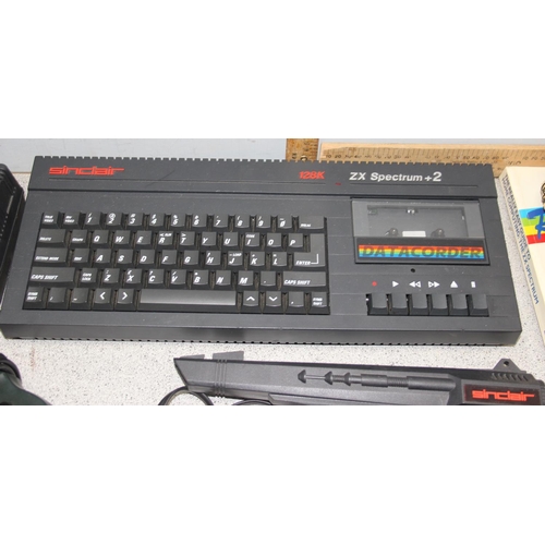 1548 - Sinclair ZX spectrum +2 128k with power lead, phaser gun, joy stick & manuals