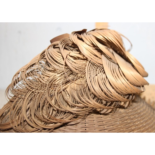 222 - Native America wickerwork - a very unusual late 19th or early 20th century wicker hat bearing the ha... 