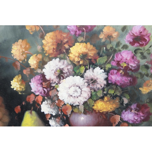 533 - Oil on canvas showing flowers & fruit signed bottom right Koromdoi Kous, approx.82cm x 40cm