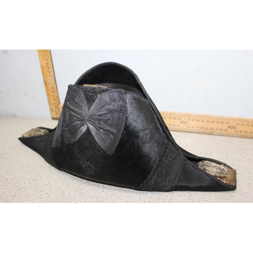 1421 - A late 19th or early 20th century British Royal Navy Bicorn hat in original painted tin case, the ha... 