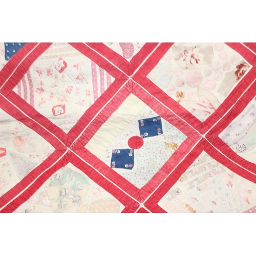 224 - A 19th century patchwork quilt with attached later paper label stating 