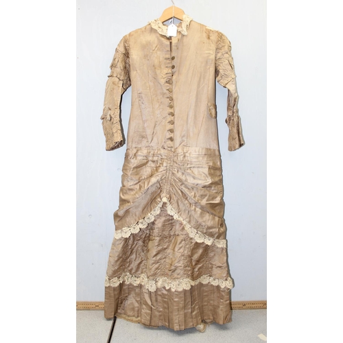 225 - A 19th century dress of small proportions, believed to be silk, hand made, various lace edging