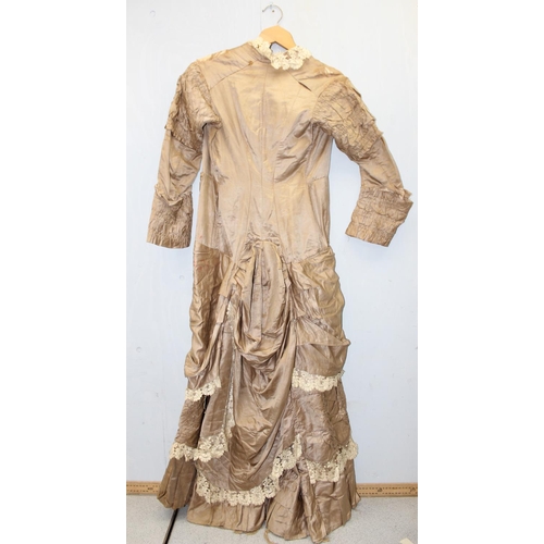 225 - A 19th century dress of small proportions, believed to be silk, hand made, various lace edging