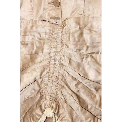 225 - A 19th century dress of small proportions, believed to be silk, hand made, various lace edging