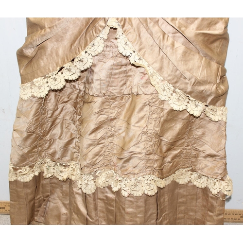 225 - A 19th century dress of small proportions, believed to be silk, hand made, various lace edging