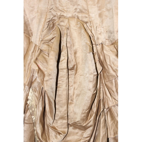 225 - A 19th century dress of small proportions, believed to be silk, hand made, various lace edging