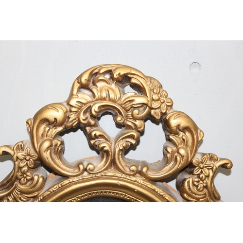 529 - A Rococo style gilt framed mirror approx 70cm tall