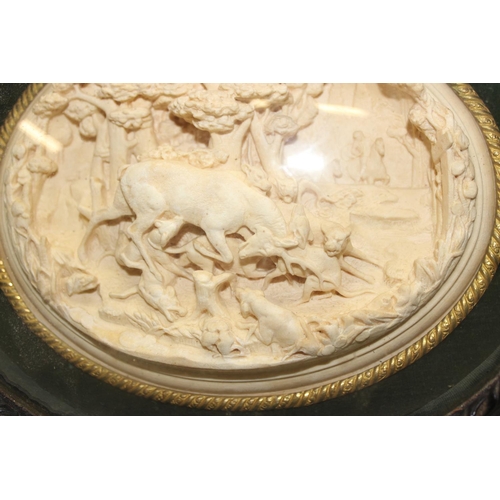 534 - A 19th century framed plaster or meerschaum relief plaque depicting a hunt scene with Stag and dogs,... 