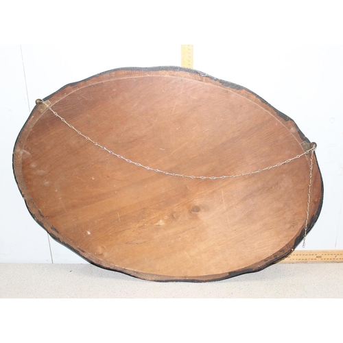 536 - An early 20th century oval wooden framed wall mirror, approx 89cm wide