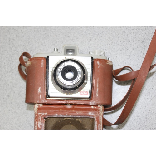 719 - Mixed lot of cameras and lenses to include a collectable Polaroid SX-70 land camera model 2 with lea... 