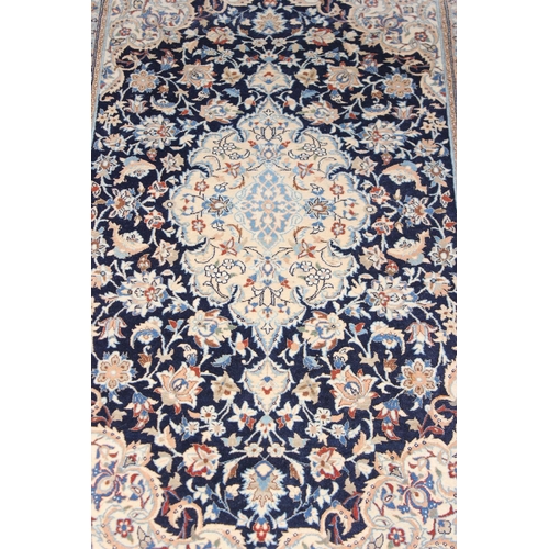 219 - An extremely finely woven Persian Isfahan rug of cream and blue ground, possibly silk, 20th century,... 