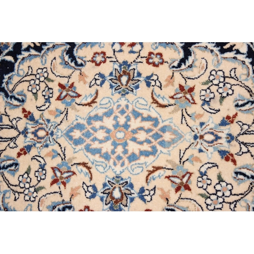 219 - An extremely finely woven Persian Isfahan rug of cream and blue ground, possibly silk, 20th century,... 