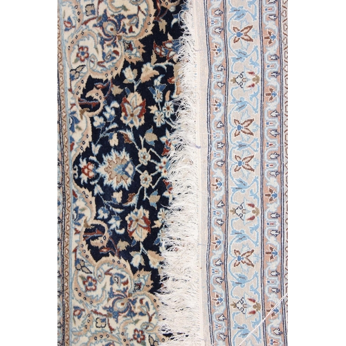 219 - An extremely finely woven Persian Isfahan rug of cream and blue ground, possibly silk, 20th century,... 