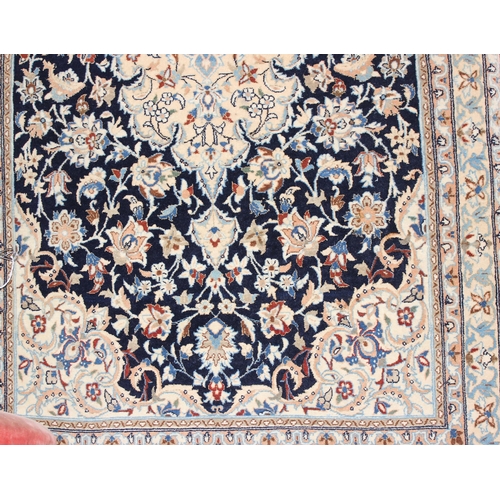 219 - An extremely finely woven Persian Isfahan rug of cream and blue ground, possibly silk, 20th century,... 