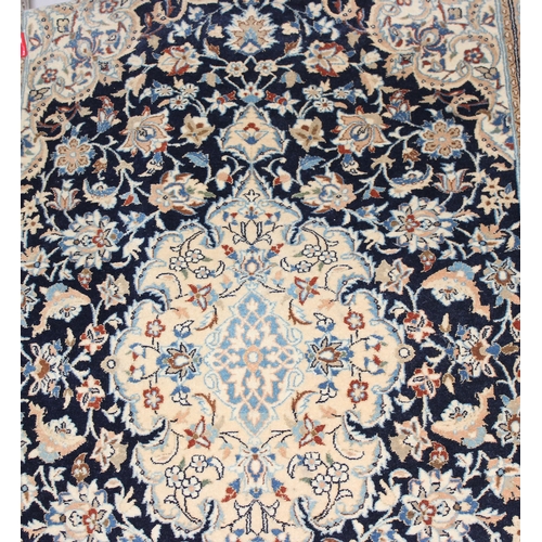 219 - An extremely finely woven Persian Isfahan rug of cream and blue ground, possibly silk, 20th century,... 