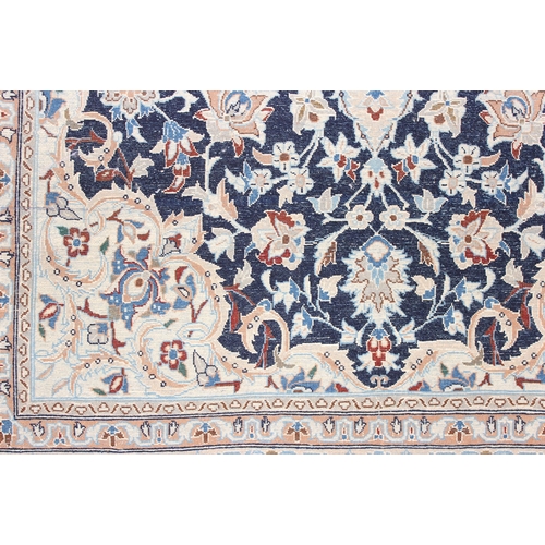 219 - An extremely finely woven Persian Isfahan rug of cream and blue ground, possibly silk, 20th century,... 