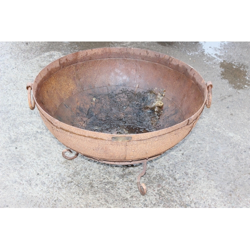 353 - A rusty metal garden fire pit or brazier on metal stand, approx 71cm in diameter