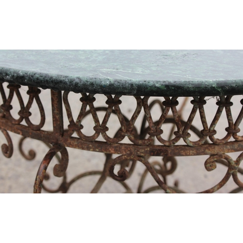 367 - An antique style marble topped garden table with distressed metal base, approx 72cm in diameter