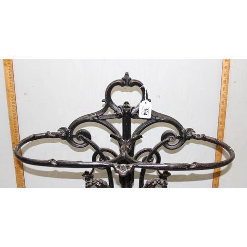 164 - A 19th century cast iron stick stand with drip tray, both pieces with various marks to inc the Victo... 