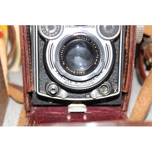 717 - A vintage Rolleiflex TLR camera in original leather case with a number of extras to inc a Rolleipark... 