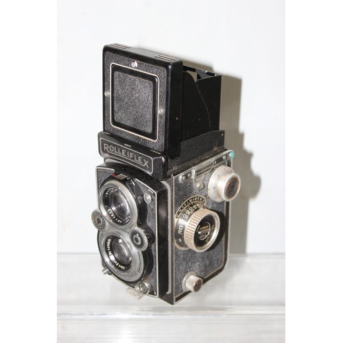 717 - A vintage Rolleiflex TLR camera in original leather case with a number of extras to inc a Rolleipark... 