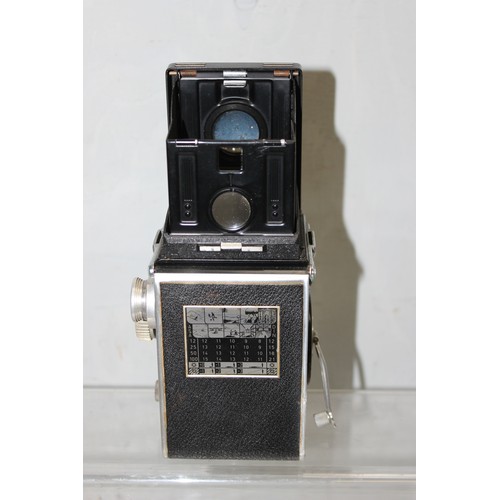 717 - A vintage Rolleiflex TLR camera in original leather case with a number of extras to inc a Rolleipark... 