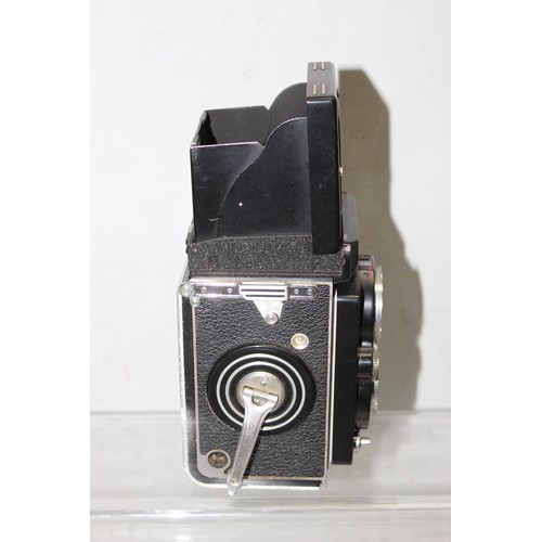 717 - A vintage Rolleiflex TLR camera in original leather case with a number of extras to inc a Rolleipark... 