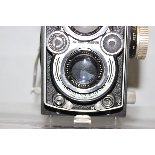 717 - A vintage Rolleiflex TLR camera in original leather case with a number of extras to inc a Rolleipark... 