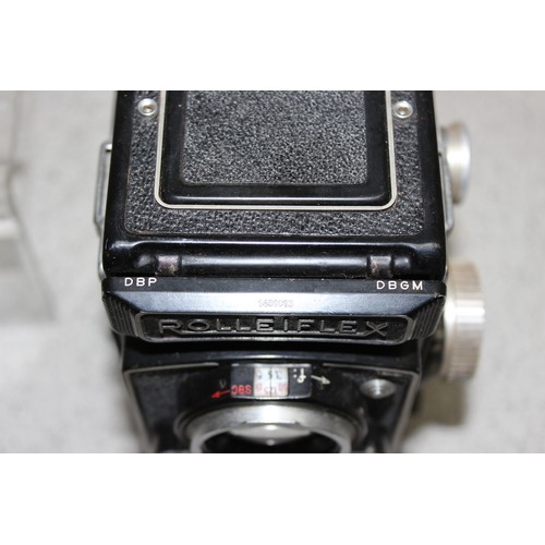 717 - A vintage Rolleiflex TLR camera in original leather case with a number of extras to inc a Rolleipark... 