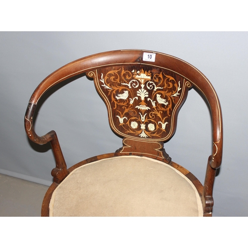 10 - An Edwardian inlaid Mahogany armchair, inlaid with various woods and faux ivory in the classical tas... 