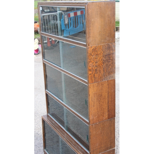 14A - A vintage 'Minty of Oxford' Oak Globe Wernicke style sectional bookcase comprising of a base section... 