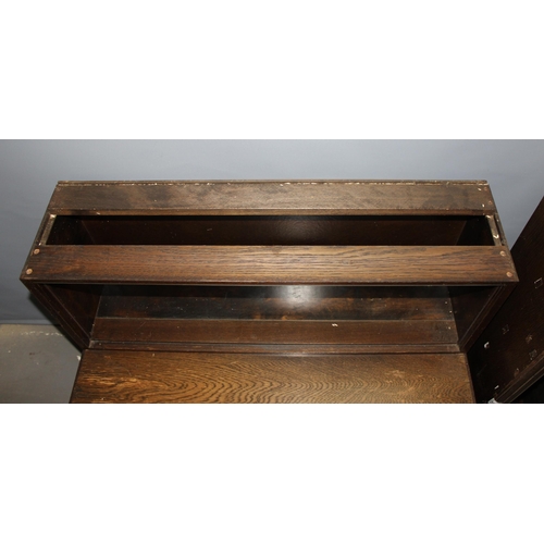 15 - A vintage Minty of Oxford oak Globe Wernicke style sectional bookcase comprising of a base section a... 