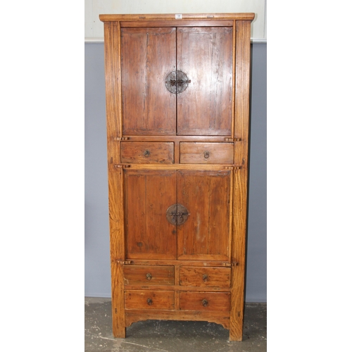 18 - A large Chinese hardwood cabinet, likely Elm with hand wrought iron fittings, likely 19th century, a... 