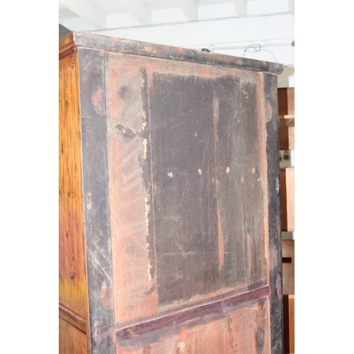 18 - A large Chinese hardwood cabinet, likely Elm with hand wrought iron fittings, likely 19th century, a... 