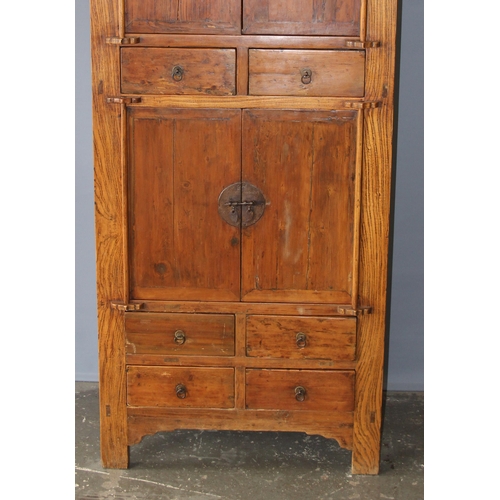 18 - A large Chinese hardwood cabinet, likely Elm with hand wrought iron fittings, likely 19th century, a... 