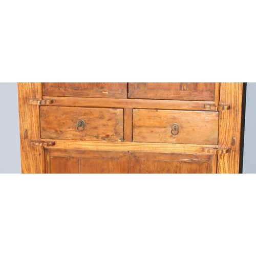 18 - A large Chinese hardwood cabinet, likely Elm with hand wrought iron fittings, likely 19th century, a... 