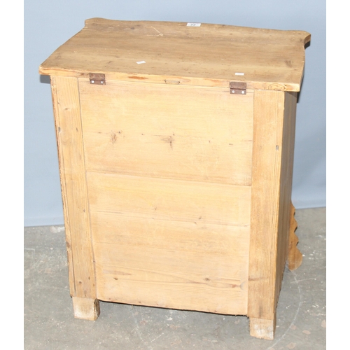 22 - A small antique Pine cupboard or desk, possibly a clerk's desk with lifting top, small drawer and cu... 