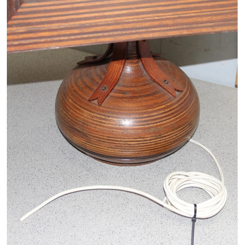 230 - An unusual mid-century turned and laminated wooden table lamp with wooden and stained glass shade, e... 