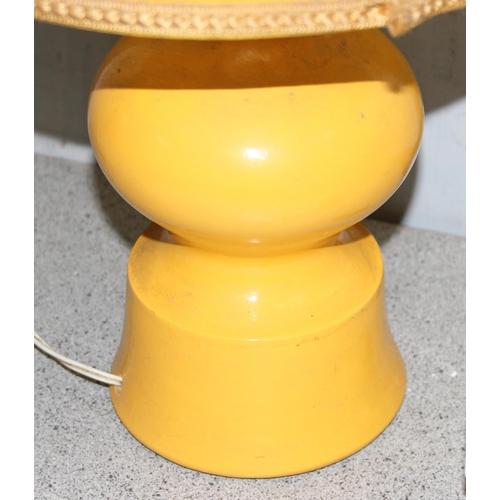 233 - A retro yellow pottery table lamp with matching shade