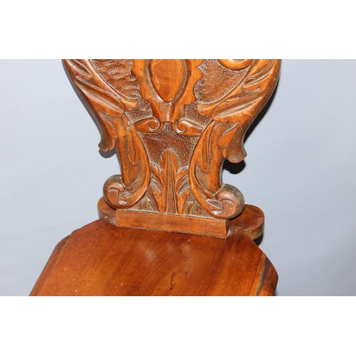 28 - An antique hall chair with deep quality carved details, approx 100cm tall