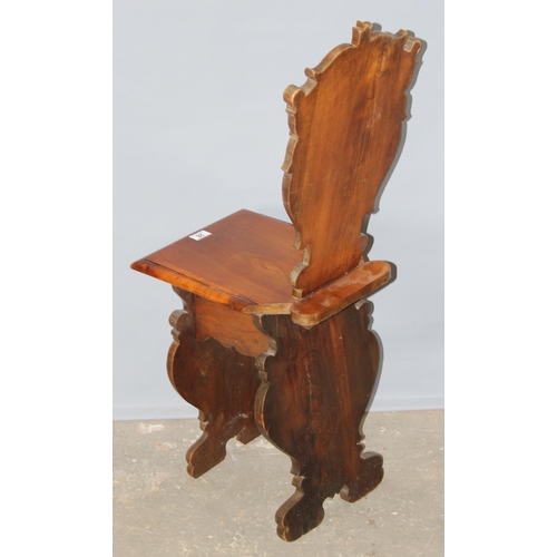 28 - An antique hall chair with deep quality carved details, approx 100cm tall