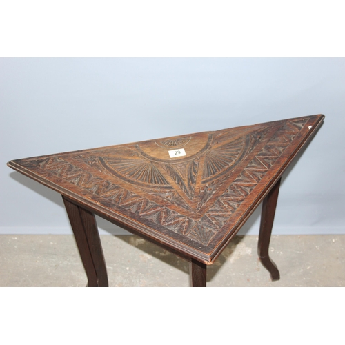 29 - A very unusual late 19th or early 20th century carved oak drop leaf table of triangular form opening... 