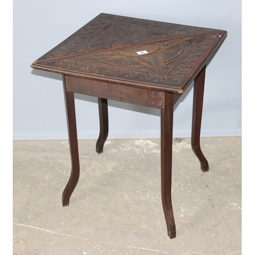 29 - A very unusual late 19th or early 20th century carved oak drop leaf table of triangular form opening... 