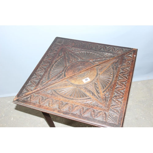 29 - A very unusual late 19th or early 20th century carved oak drop leaf table of triangular form opening... 